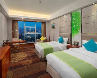 Zhangjiajie Huatian Hotel - Zhangjiajie - Bedroom