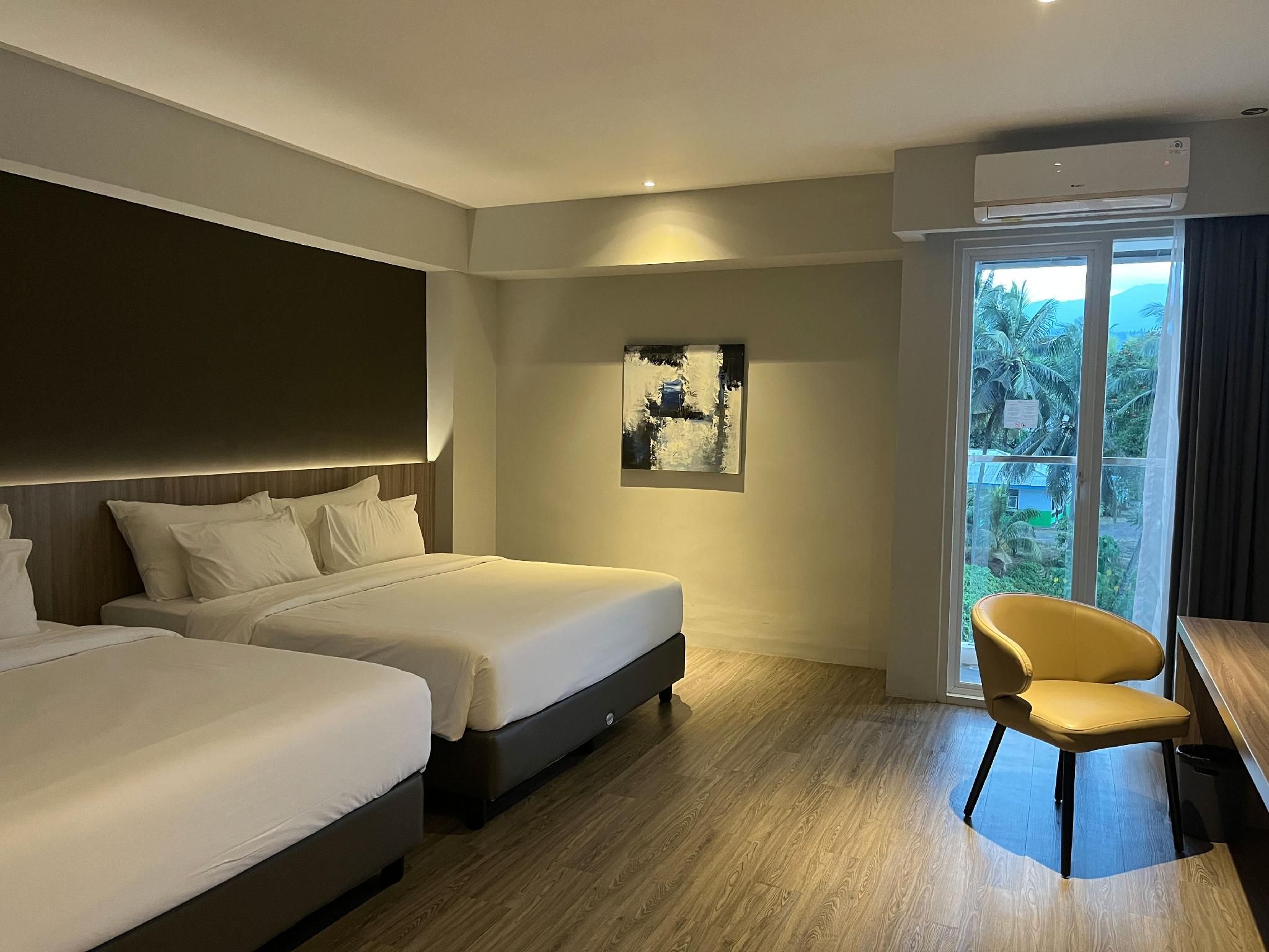 Rogers Hotel Manado - مانادو - غرفة نوم