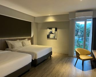 Rogers Hotel Manado - Manado - Schlafzimmer
