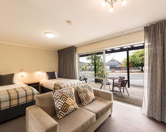 Suncourt Hotel & Conference Centre - טאופו - חדר שינה