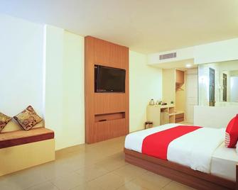 Collection O 166 Hotel Princess - פלמבאנג - חדר שינה