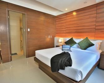 Valero Grand Suites by Swiss-Belhotel Makati - Makati - Schlafzimmer