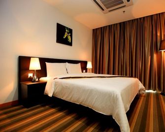Merdeka Suites Hotel - Miri - Habitación