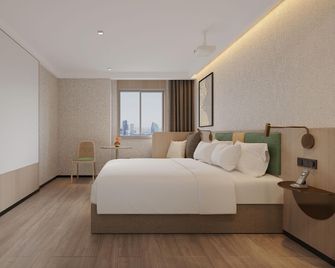 Happy Travel Hotel (Haikou Mova Commercial Square Duty Free) - Haikou - Bedroom