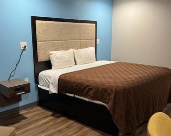 Executive Inn and Suites - Baker - Спальня