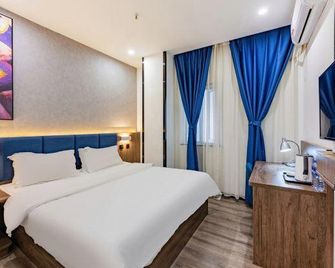 7 Days Premium Hotel (Shijiazhuang Donggang Road Dashimen) - שה-ג'יאג'וואנג - חדר שינה