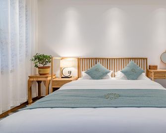 Floral Taishan Scenery hotel - 泰安 - 臥室