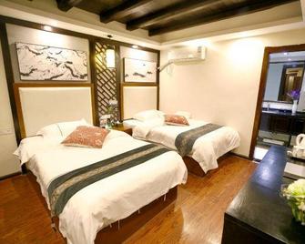 Xijiang Luanxi Hanshe Garden Hotel (No. 1 Fengyu Bridge Branch) - Qiandongnán - Habitación