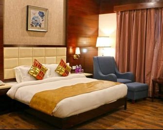 Tiaraa Hotels & Resorts - Rāmnagar - Ložnice