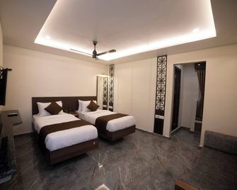 Murali Krishna Apart Hotel - Kakinada - Slaapkamer