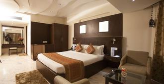 The Oasis Hotel - Vadodara - Bedroom