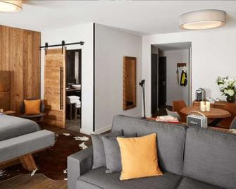 Ecrin Blanc Resort Courchevel - Aquapark - Courchevel - Living room