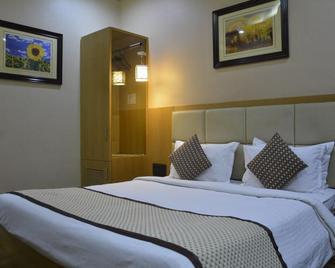 Hotel Surya Executive - Solāpur - Slaapkamer