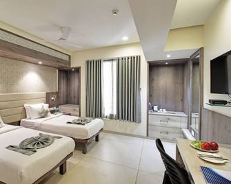 Svasti Inn Jamnagar - Jamnagar - Schlafzimmer