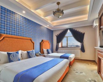 Riyueming Select Hotel (Dalian Xinghai Park) - Dalian - Bedroom