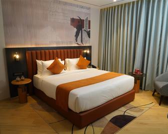 Ramada Encore by Wyndham Chandigarh Zirakpur - Zerakpur - Slaapkamer