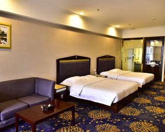 Zhongshan Hui Quan Hotel - Zhongshan - Yatak Odası