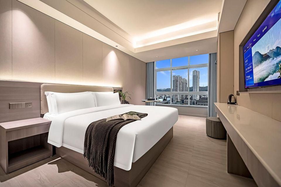 Meijin Hotel (Jishou Railway Station Branch) - Xiangxi - Bedroom