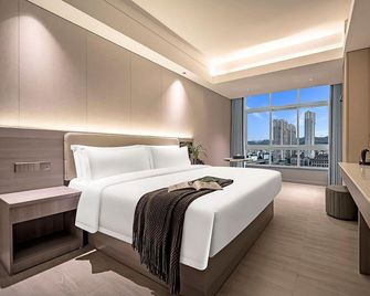 Meijin Hotel (Jishou Railway Station Branch) - Xiangxi - Bedroom