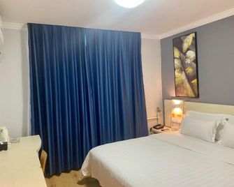 Xianchaoda Chain Hotel Huludao Huaji Road - Huludao - Camera da letto