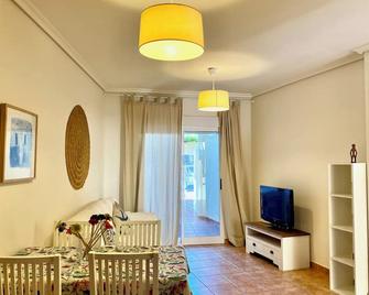 Apartamento en Planta Baja con Terraza con Salida Directa a la Piscina - Denia - Living room