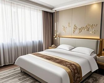 Beiguo Zhichun Business Hotel - Hulunbuir - Спальня