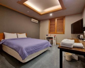Asan T Hotel - Asan - Camera da letto
