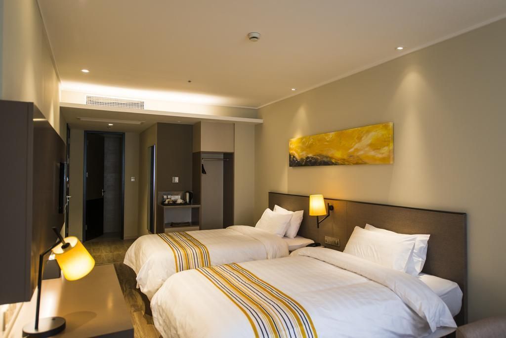 Home Inn Plus Nanchang High-tech Huoju Plaza - نانتشانغ - غرفة نوم