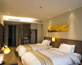 Home Inn Plus Nanchang High-tech Huoju Plaza - نانتشانغ - غرفة نوم