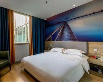 Pai Hotel Jiuquan Gulou Jianshe Road - Jiuquan - Bedroom