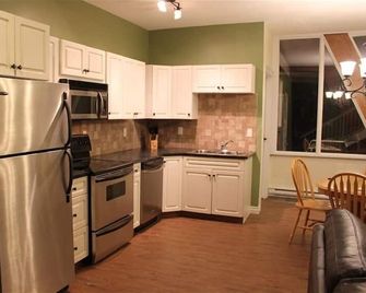 Ski in and Ski out right to the doorstep. With a private hot tub on the deck. - Vernon - Kitchen