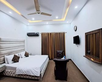 Green Land Hotel Lahore - Lahore - Slaapkamer