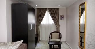 Sparklyn Hotels & Suites - Port Harcourt - Schlafzimmer