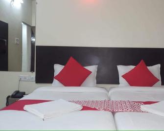 Arjun Pride Hotel - Bārāmati - Habitación