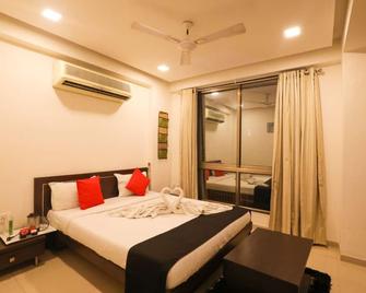 Hotel Shrimad Residency - Ahmedabad - Κρεβατοκάμαρα