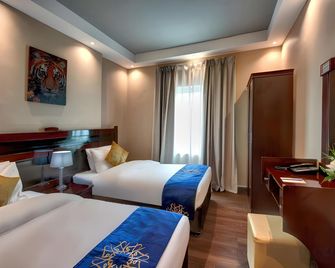 Al Bustan Tower Hotel Suites - Sharjah - Habitación