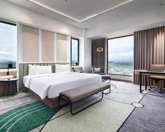 Luwansa Hotel and Convention Center Manado - Манаго - Спальня