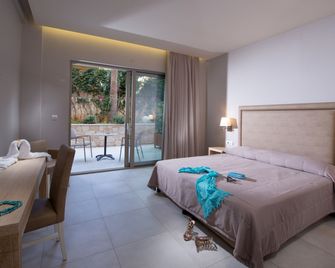 Cactus Beach Hotel - סטאליס - חדר שינה