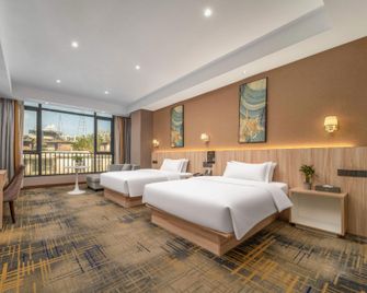 Huangyue Hotel (Wuzhou Arcade City) - Wuzhou - Bedroom
