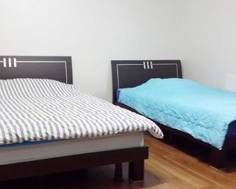 Minjoonggak - Seogwipo - Schlafzimmer