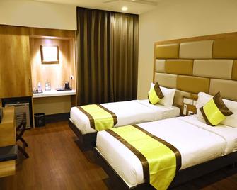 Taz Kamar Inn - Chennai - Schlafzimmer