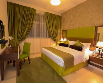 Al Waleed Palace Hotel Apartments-Al Barsha - Dubai - Bedroom