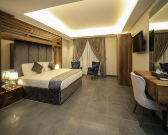 The Taj Hotel. - Bagdad - Slaapkamer