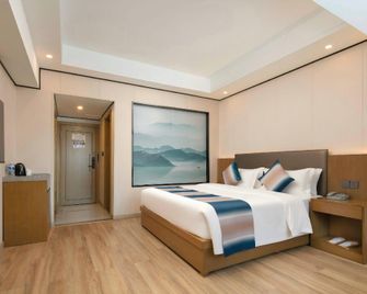 Zhangjiajie Fulante News Business Hotel - Zhangjiajie - Bedroom