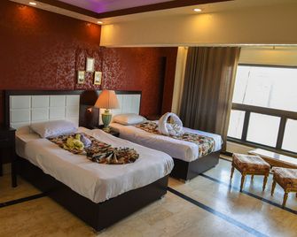 فندق وأجنحة نايل سكاي - القاهرة - غرفة نوم