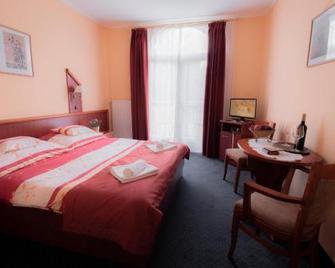 Boglárka Panzió - Étterem - Mezokovesd - Slaapkamer