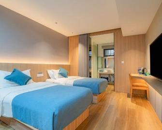 Luck 7 Inn - Jingzhou - Schlafzimmer