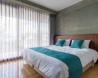 Bosco Yomitan Resort Condminium - Yomitan - Schlafzimmer