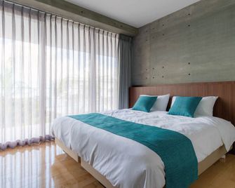 Bosco Yomitan Resort Condminium - Yomitan - Bedroom