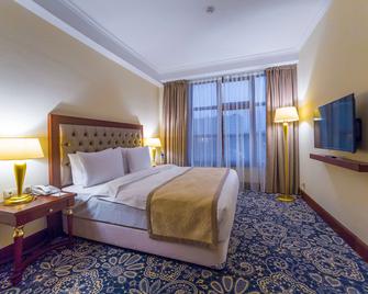 رامادا باي ويندام ألماتي - ألماتي - غرفة نوم